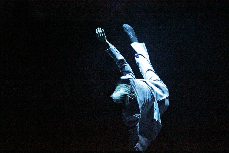 In the air: A member of the EKI Dance Company tumbles and sways his way through a performance.