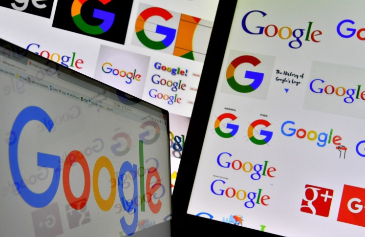 This file photo taken on November 20, 2017 shows shows logos of US technology company Google displayed on computer screens. 