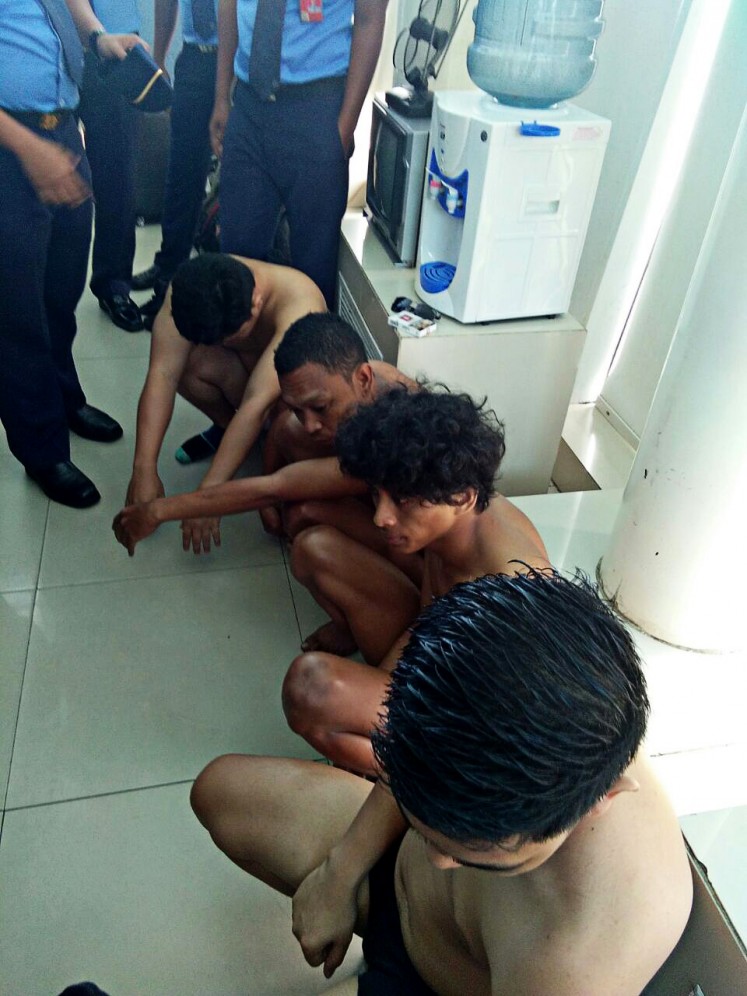 Suspects: Four Citilink passengers are held after being arrested on Friday for allegedly carrying crystal methamphetamine on their bodies.
