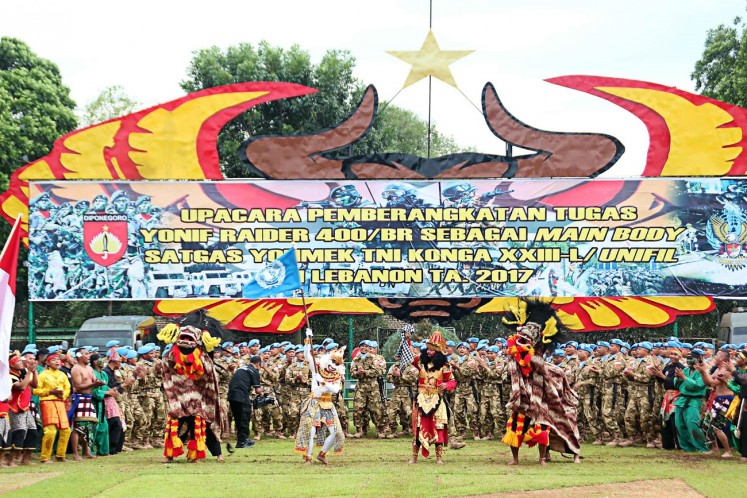 Upholding tradition: Personnel of the Banteng Raider Infantry Battalion (Yonif Raider) stage traditional performances during a ceremony on Friday to mark their dispatch for a peacekeeping mission in Lebanon.