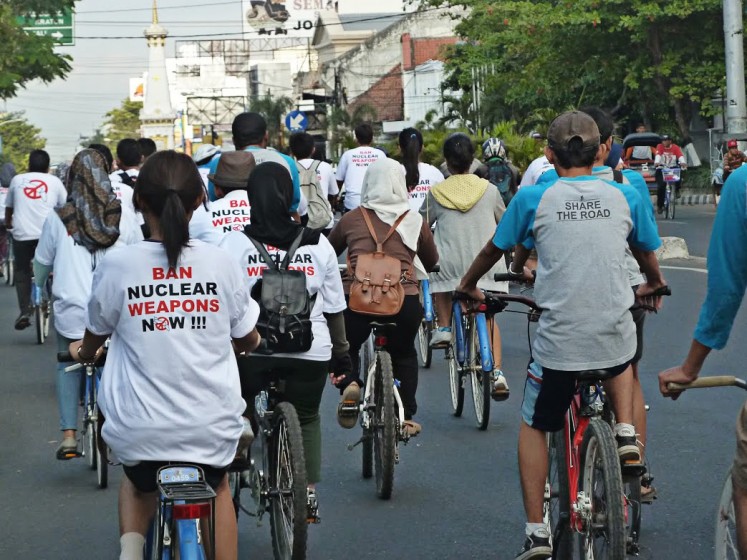 Promoting peace: Gadjah Mada University activists hold a cycling event in Yogyakarta recently to campaign for the prohibition of nuclear weapons. 