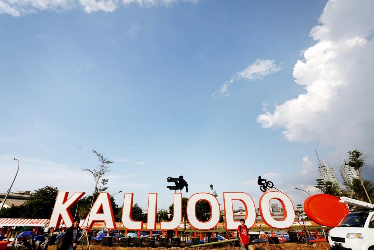 New face: Kalijodo is currently home to a large skate park for children, and on weekends, market stalls sell food and drinks to families.