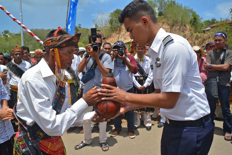 Blessings: An elder from a customary village welcomes Resto during a traditional ceremony held for his naming as the youngest pilot in Kampung Mbrata, West Manggarai, East Nusa Tenggara.