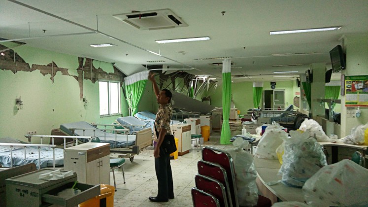 Damaged: A three-story building that houses an emergency installation (IGD), radiology and haemodialysis units at the Banyumas General Hospital (RSUD) in Central Java is worst hit by a strong earthquake on Friday evening.