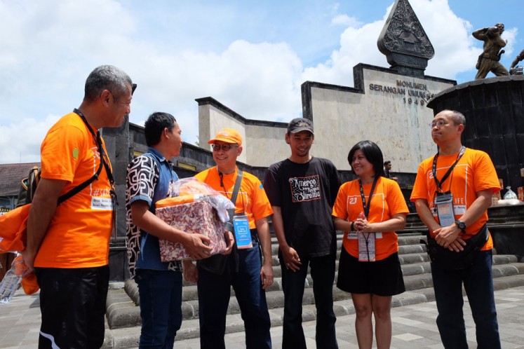 Helping out: PT BNI Life Insurance acting executive director Geger Maulana (third left) and directors Hirokazu Todaka (left), Naruyoshi Kuwata (right) and Intan Abdams Katoppo (second right) chat during an outing and social activity in Yogyakarta on Dec. 9 that saw them give aid to survivors of the Gunung Kidul disaster. The activity was also aimed at celebrating BNI Life's 21st anniversary at an event that saw the participation of 1,200 company employees and members of the board of directors. It also included educational outreach on finance for the public. 