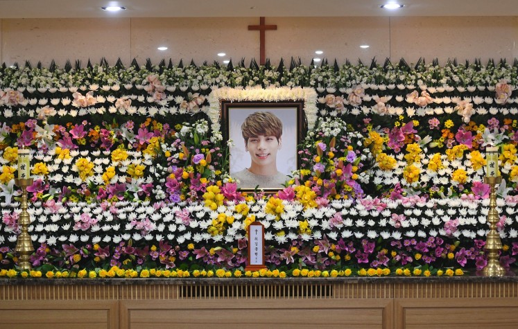 The portrait of Kim Jong-Hyun, a 27-year-old lead singer of the massively popular K-pop boyband SHINee, is seen on a mourning altar at a hospital in Seoul on December 19, 2017. 