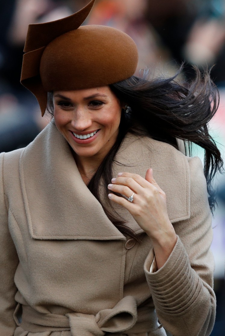 US actress and fiancee of Britain's Prince Harry Meghan Markle arrives to attend the Royal Family's traditional Christmas Day church service at St Mary Magdalene Church in Sandringham, Norfolk, eastern England, on December 25, 2017. 