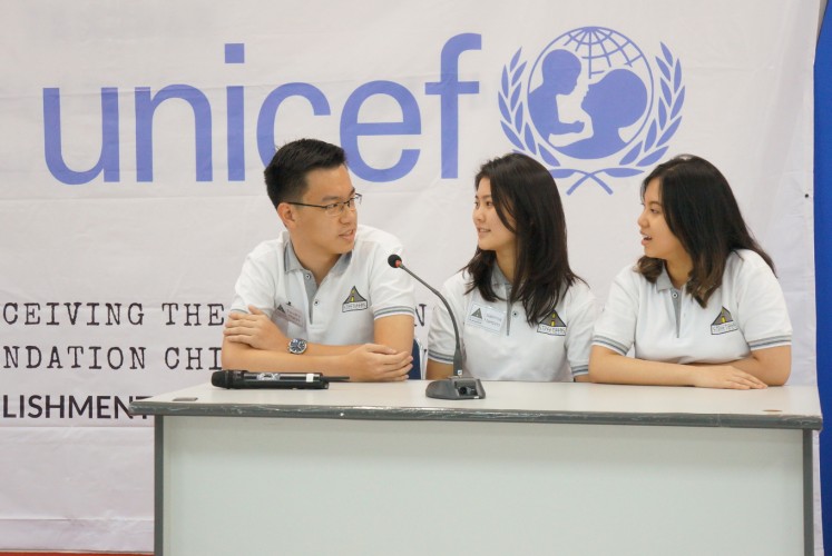 Some of the core members of Streetizens, Timothy Sam Wijaya (left), Sabrina Hartono (center) and Felicia Widjaya, talk about their organization.