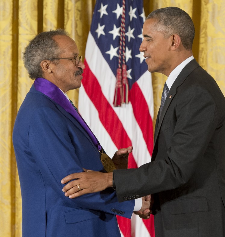 US President Barack Obama presents painter Jack Whitten with the 2015 National Medal of Arts during a ceremony in the East Room of the White House in Washington, DC, September 22, 2016. 