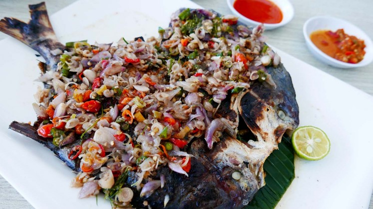 Grilled fish served with Balinese-style chopped sambal at Seafood City Bandar Djakarta restaurant. 