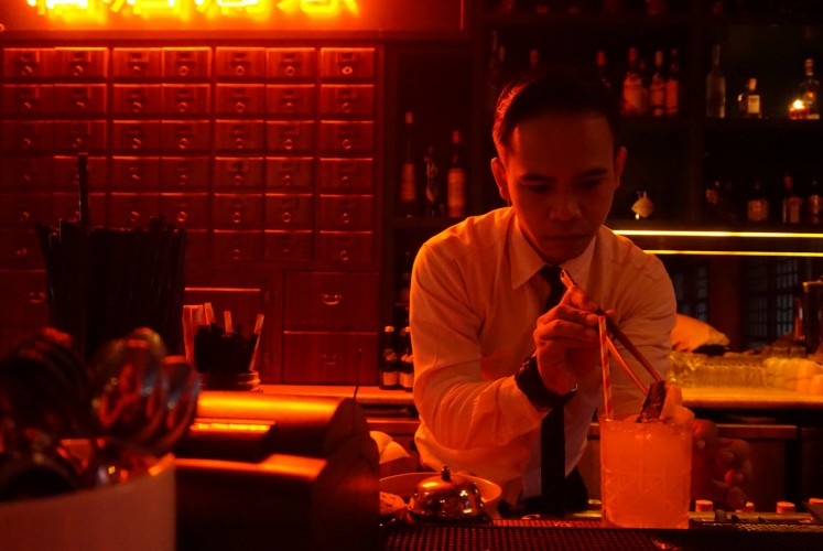 Bartender creates a cocktail at Pao Pao Liquor Bar and Dimsum Parlour.