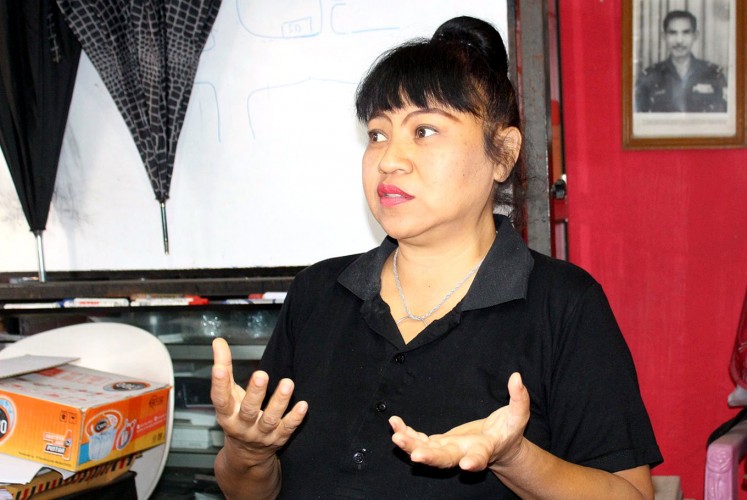 Asri Rahayu Agustina or Leotina, the owner of a shelter for cats and dogs in Malang.