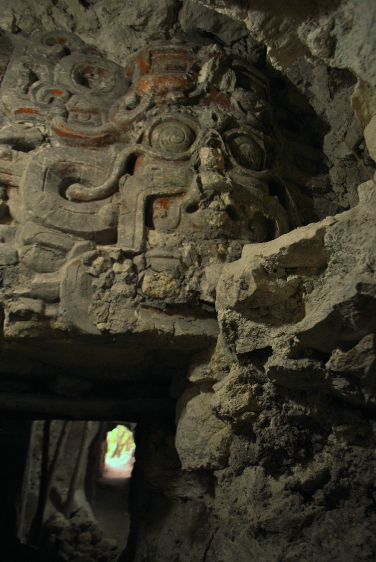 Undated handout picture released by El Zotz Archaeological Project showing a bas-relief depicting the Night Sun found under a pyramid at the Zotz archaeological site, in the Peten jungle, 550 km north of Guatemala City. A