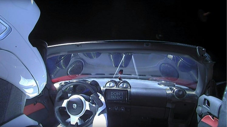 This still image taken from a SpaceX livestream video shows 'Starman' sitting in SpaceX CEO Elon Musk's cherry red Tesla roadster after the Falcon Heavy rocket delivered it into orbit around the Earth on February 6, 2018. Screams and cheers erupted at Cape Canaveral, Florida as the massive rocket fired its 27 engines and rumbled into the blue sky over the same NASA launchpad that served as a base for the US missions to Moon four decades ago.