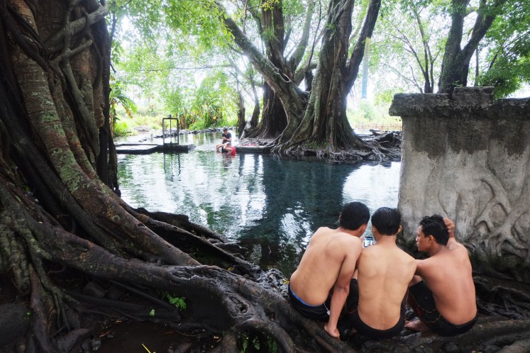 Visitors at Umbul Kapilaler in Klaten, Central Java.