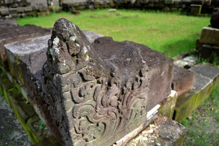 A close-up shot reveals the carvings on a stone block of the Kedulan Temple, which will be reunited with the rest of the stone blocks in reconstructing the temple.