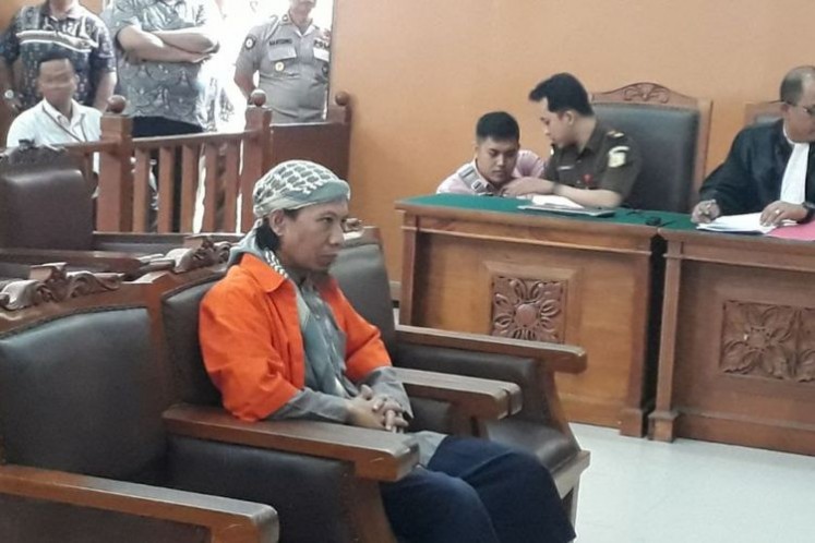 Aman Abdurrahman (center), the alleged mastermind of the Jan. 14, 2016 suicide bombings and gun attacks on Jl. MH Thamrin, Central Jakarta, during a court hearing in South Jakarta District Court on Feb. 15. 