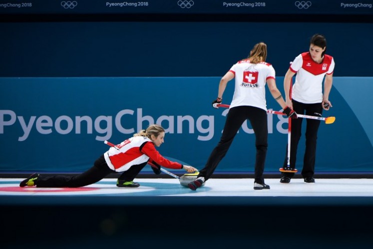 Switzerland's Silvana Tirinzoni throws the stone during the women's curling round robin session between the Olympic Athletes from Russia and Switzerland during the Pyeongchang 2018 Winter Olympic Games on Feb. 19, 2018. 