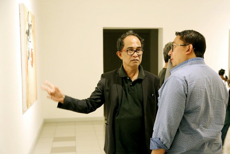 Meet the collector: Painter Yoes Rizal (left) chats during his solo exhibition opening with House of Representatives Deputy Speaker Fadli Zon from the Gerindra Party at the National Gallery. Fadli is a well-known enthusiastic art collector.