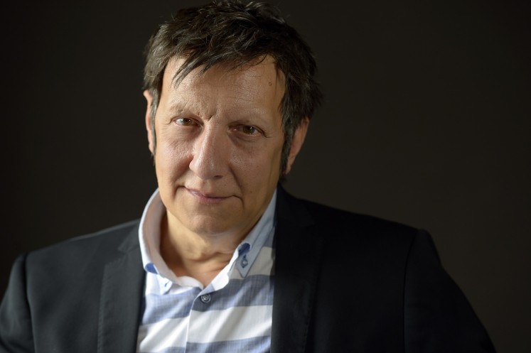 In this file photo taken on September 7, 2015 Quebecer playwright, stage director, actor and filmmaker Robert Lepage poses in Paris. 