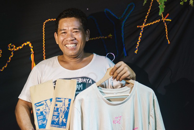 Homemade: A Rumah Berdaya activist shows a screen-printed T-shirt and packages of incense produced by participants of the life-skill training.