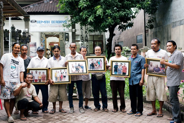 Family support: Rumah Berdaya activists and participants pose with their family portraits.