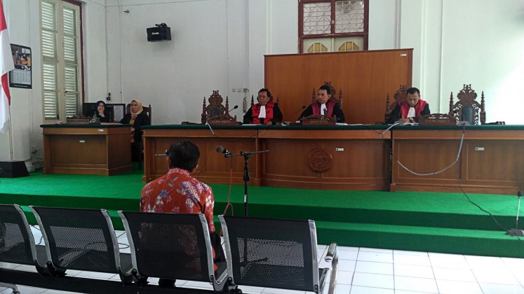 Disgraced: Former Takalar regent Burhanuddin Baharuddin attends his first graft trial at the Makassar Corruption Court in Makassar, South Sulawesi, on Feb.22. 