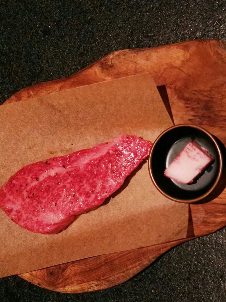 A tri-tip steak ready to be grilled at AB Steak by Akira Back Jakarta.