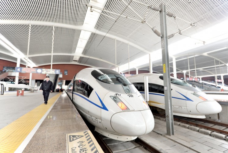 Super fast: A high speed train from Harbin to Qiqihar waits to pull out of the train station in Harbin, northeast China's Heilongjiang province.