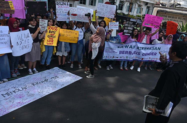 Seeking safer places: Women's rights activists call on the government to ensure women's safety and security in public spaces during the 2018 Women's March in Malang, East Java, on March 5.