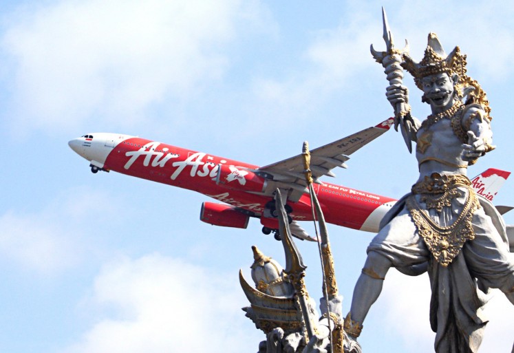 Flying high: An AirAsia aircraft takes off from Ngurah Rai International Airport.