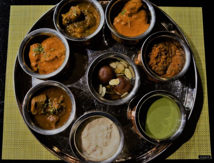 A 'thali' set is a traditional Indian service that comes complete with main courses, condiments and dessert on a single tray.