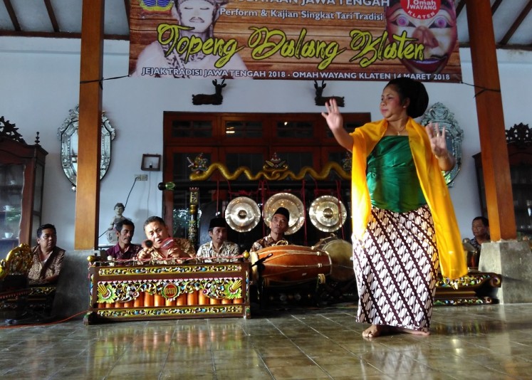 Giyah Supanggah, 50, dances as Emban Raja Jenggala in Klaten, Central Java, on Wednesday.