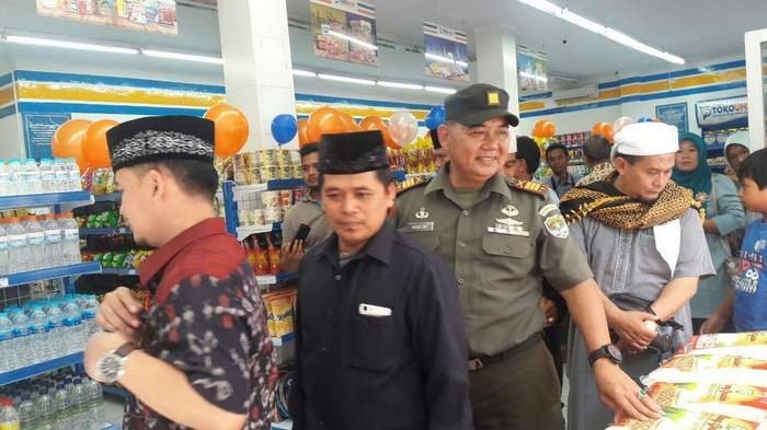Depok authorities in West Java are seen at the inauguration of Toko Umat, a Muslim minimarket where customers will not find condoms, cigarettes or alcoholic drinks on sale, on March 18.