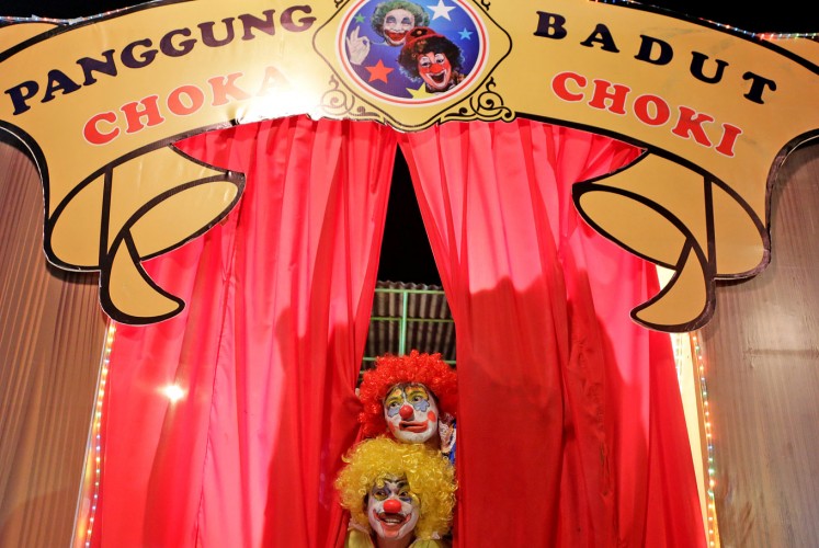 Send in the clown: The clowns (Donny Damara and Ence Bagus) begin their performance.