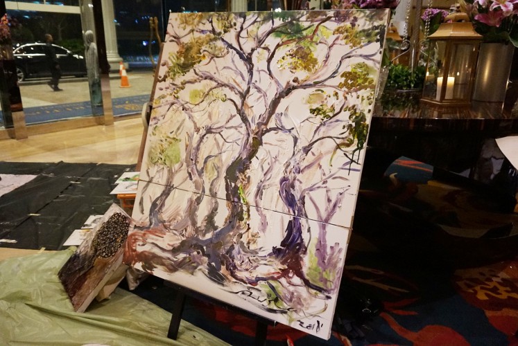 M. Ruslan's painting created during Earth ‘ART’ Hour on Saturday consists of two canvases that complement each other to symbolize the wholeness of nature