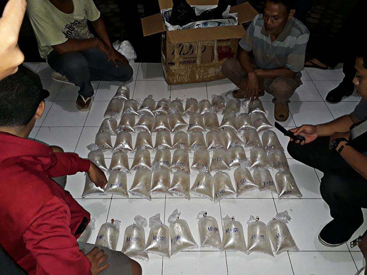Prime commodity: West Nusa Tenggara (NTB) Police personnel confiscate thousands of lobster larvae during an operation in Central Lombok regency, NTB, on April 2. 