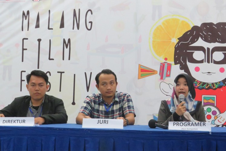 From left to right: MAFI Fest 2018 director Fikri Hidayat, documentary film judge Nashiru Setiawan and program director Sestria Herdianti join a press conference prior to the opening of the Malang Film Festival 2018 in Malang, East Java, on April 4.