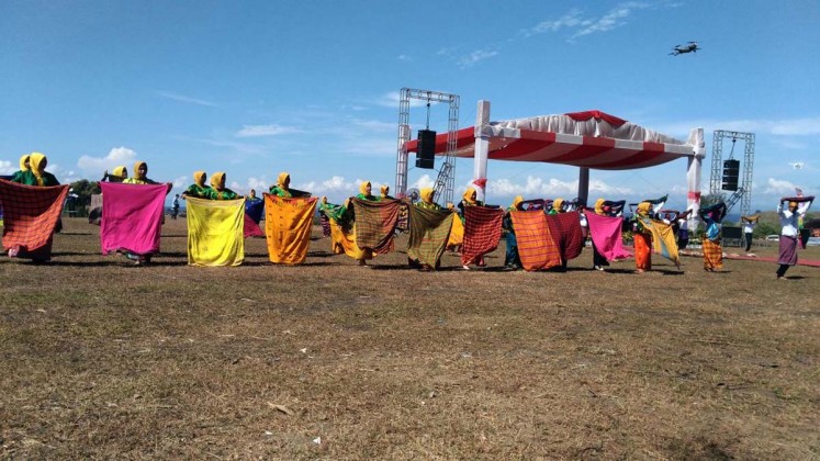 Several dancers perform Tambora traditional dances during the Pesona Tambora Festival on April 11, at Doro Ncanga savanna in Dompu regency, West Nusa Tenggara.