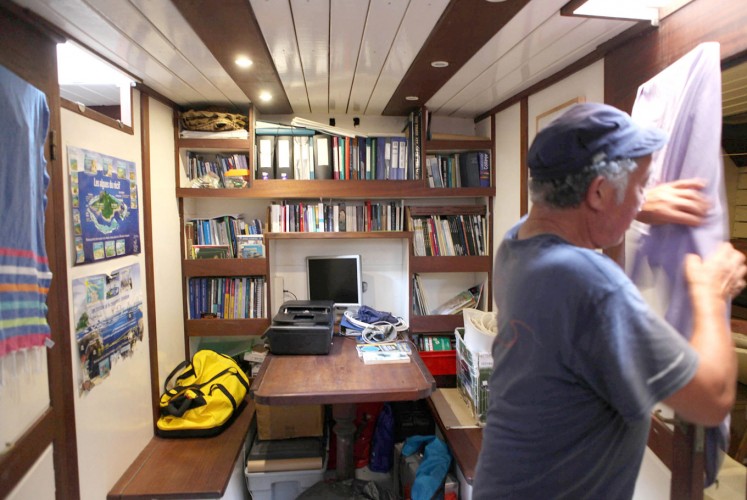 Sanctuary: A ship volunteer tidies up its working room.