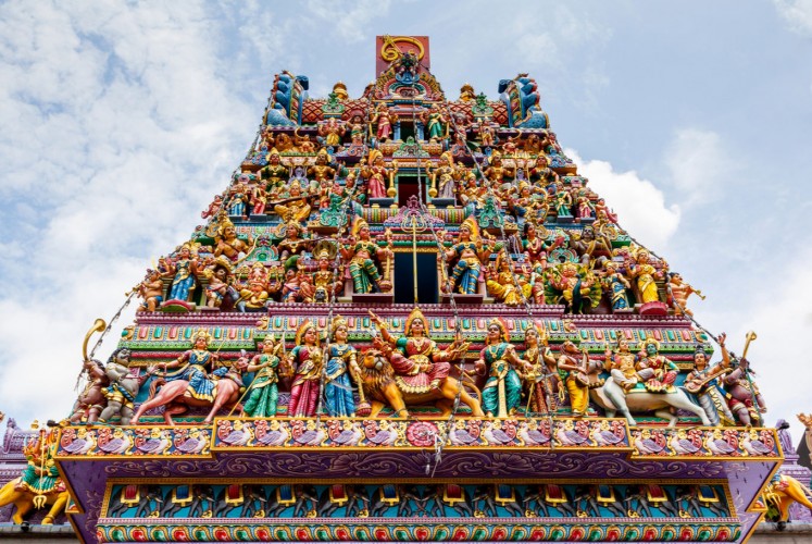 Intricate Hindu art and deity carvings on the facade of Sri Veeramakaliamman Temple in Little India, Singapore