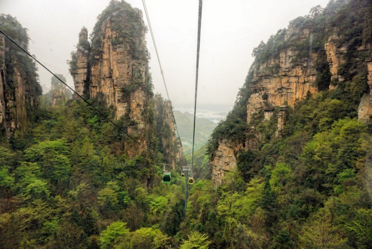 A cable car takes visitors through the heart of the Zhangjiajie National Forest Park.