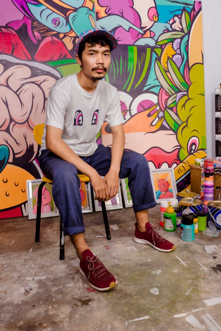 Muklay, a pop-art painter who recently collaborated with retail fashion brand Uniqlo.