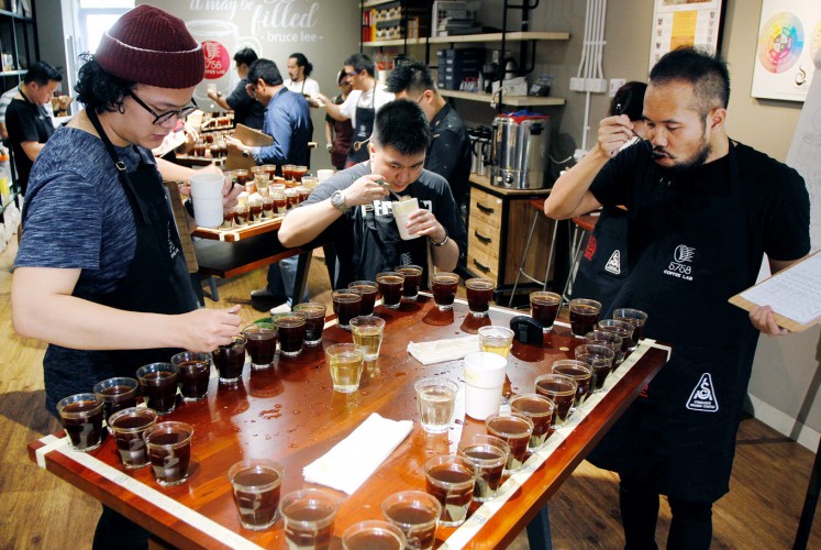 Team work: Coffee cuppers are divided into groups of three during a Sensory Education Training session at 5758 Coffee Lab.