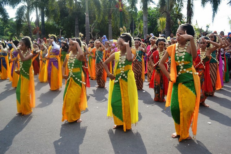 Cultural preservation: Dozens of female students perform gambyong, a Javanese traditional dance, during Solo Menari 2017 in Surakarta, Central Java. 