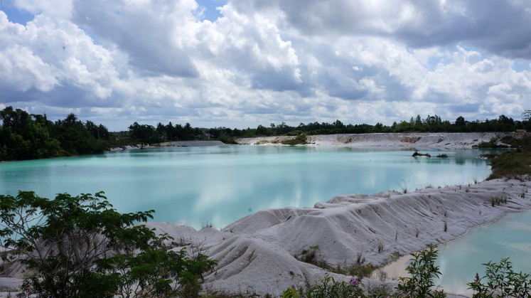 Once the site of a mine, Kaolin Lake in Tanjung Pandan, Belitung regency, offers a cool vista of its turquoise waters.