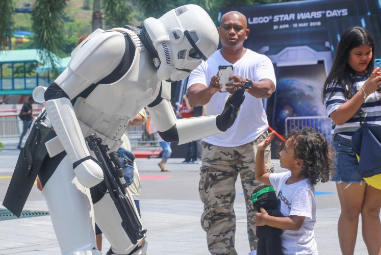A member of the Star Wars Costumed Fan Groups meets a little fan during Legoland Malaysia Resort's Lego Star Wars Days.