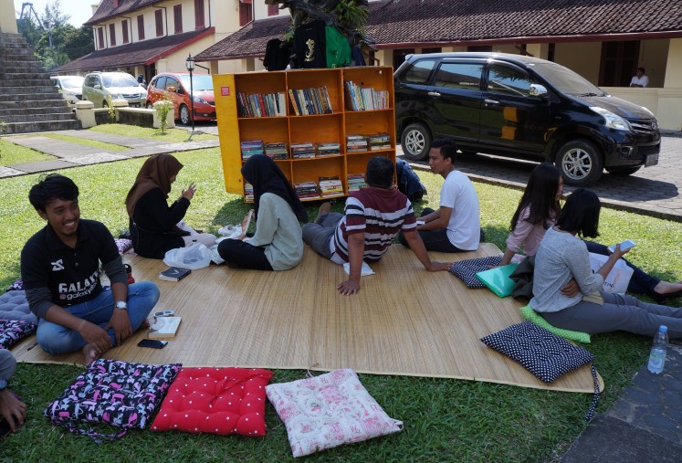 Visitors of #BarruMembaca lounge near the mobile library.