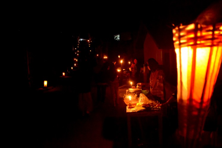 The streets of Noyu village lit by hundreds of kerosene lamps.