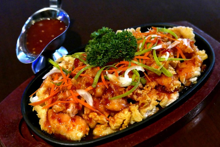Crispy chicken with salad sauce is on the menu at T-Rex Karaoke, Grand Indonesia mall, Jakarta.